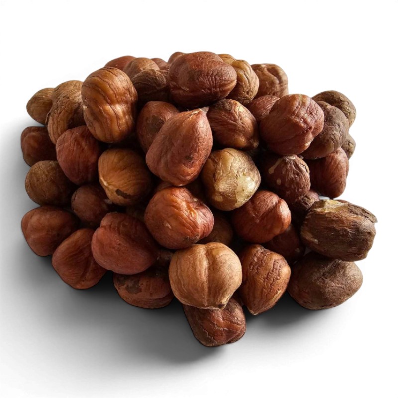 Pile of hazelnuts in brown shells on a white background