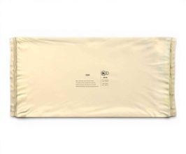 Flat, sealed beige snack-bar wrapper lying on a white background with small center logos and text for branding
